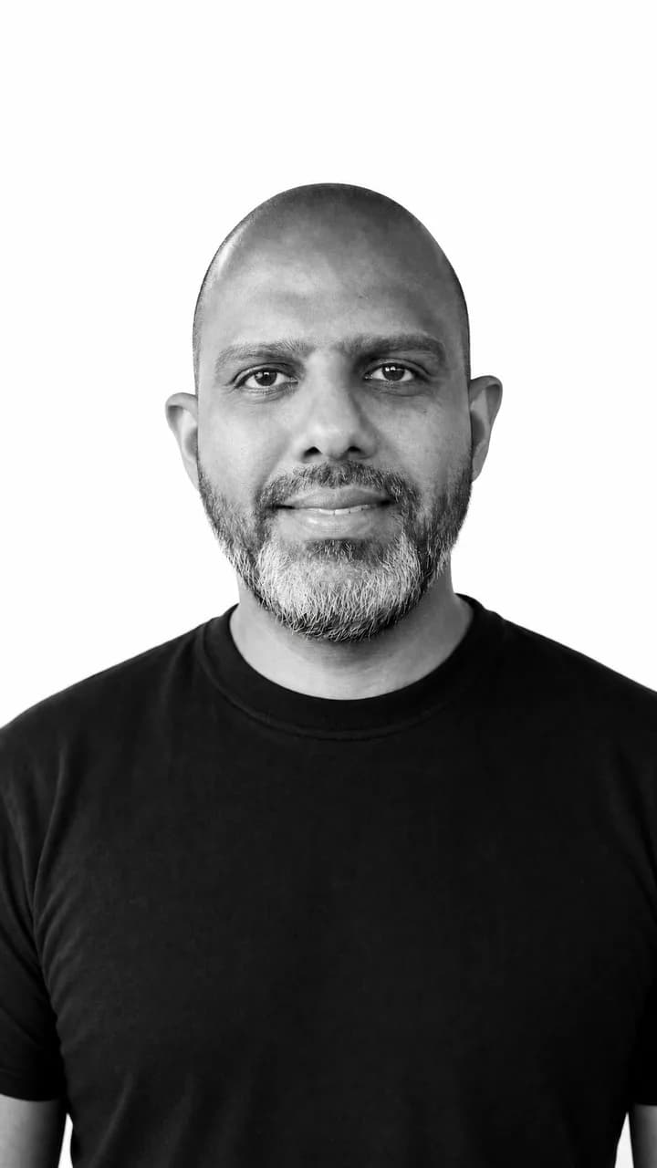 Indika Adikari, black-and-white studio portrait